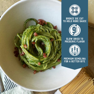 Prepared Sfoglini Bigoli pasta with green sauce and crispy pancetta on a dish. With product feature icons and text - Bronze die cut to hold more sauce. Slow dried to preserve flavor. Premium semolina for a better bite.