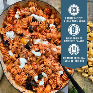 Prepared Sfoglini Radiators pasta with red sauce, vegetables, and cheese in a pot. With product feature icons and text - Bronze die cut to hold more sauce. Slow dried to preserve flavor. Premium semolina for a better bite.