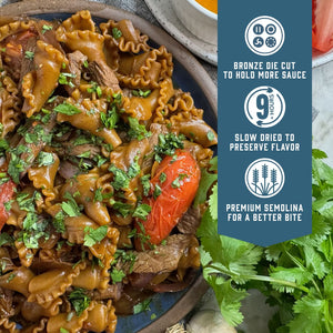 Prepared Sfoglini Porcini Trumpets pasta on a dish. With product feature icons and text - Bronze die cut to hold more sauce. Slow dried to preserve flavor. Premium semolina for a better bite.