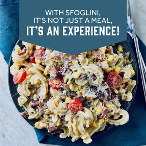 Prepared Sfoglini Cascatelli by Sporkful pasta  with corn tomatoes and cheese on a dish. With text  - WITH SFOGLINI, IT'S NOT JUST A MEAL, IT'S AN EXPERIENCE!