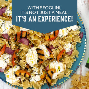 Prepared Sfoglini Reginetti  pasta with grilled peaches and cheese on a dish. With text  - WITH SFOGLINI, IT'S NOT JUST A MEAL, IT'S AN EXPERIENCE!