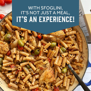 Prepared Sfoglini Whole Grain Einkorn Ziti with chicken and olives pasta in a pot. With text  - WITH SFOGLINI, IT'S NOT JUST A MEAL, IT'S AN EXPERIENCE!