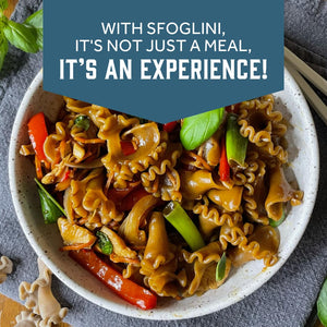 Prepared Sfoglini Porcini Trumpets pasta with vegetables and basil on a dish. With text  - WITH SFOGLINI, IT'S NOT JUST A MEAL, IT'S AN EXPERIENCE!