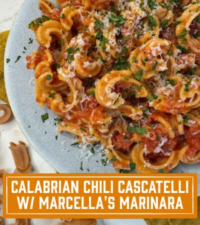 Platter of Calabrian Chili Cascatelli with Marcella's Marinara on a white plate.