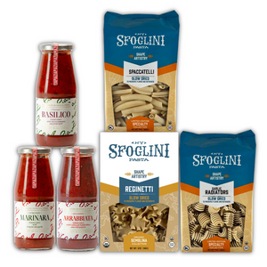 The Sfoglini Classic Italian Pantry Set with Reginetti, Spacatelli, and Garlic Radiators pasta packages and Basilico, Marinara, and Arrabbiata pasta sauce jars.