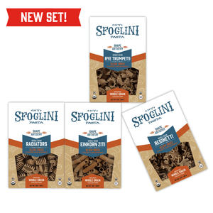 The Whole Grain Pasta Sampler Set with Rye Trumpets, Einkorn Ziti, Whole Grain Reginetti, Whole Grain Radiators pasta boxes. Additional text of  "New Set!"